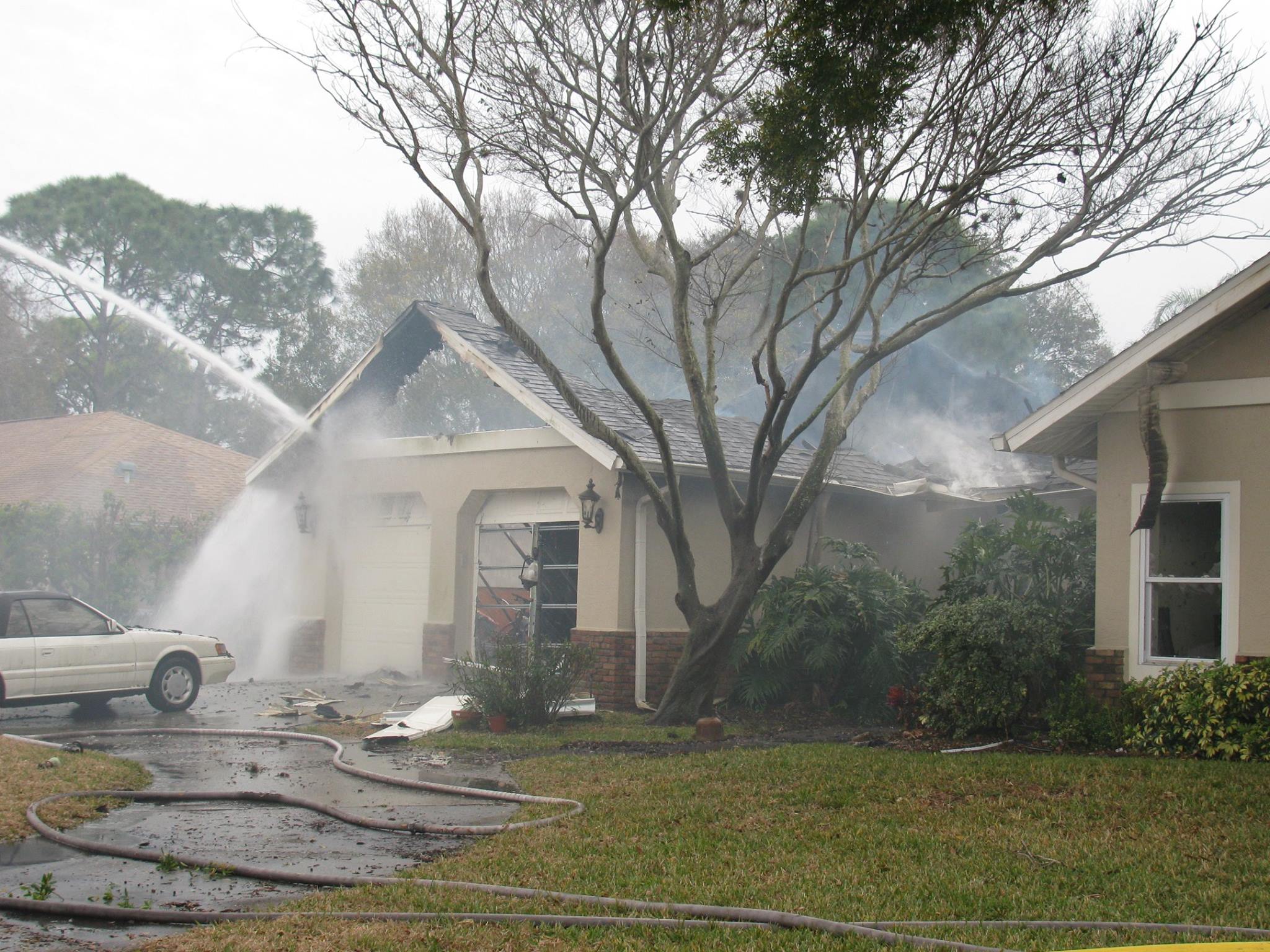 Photo of house being sprayed with water