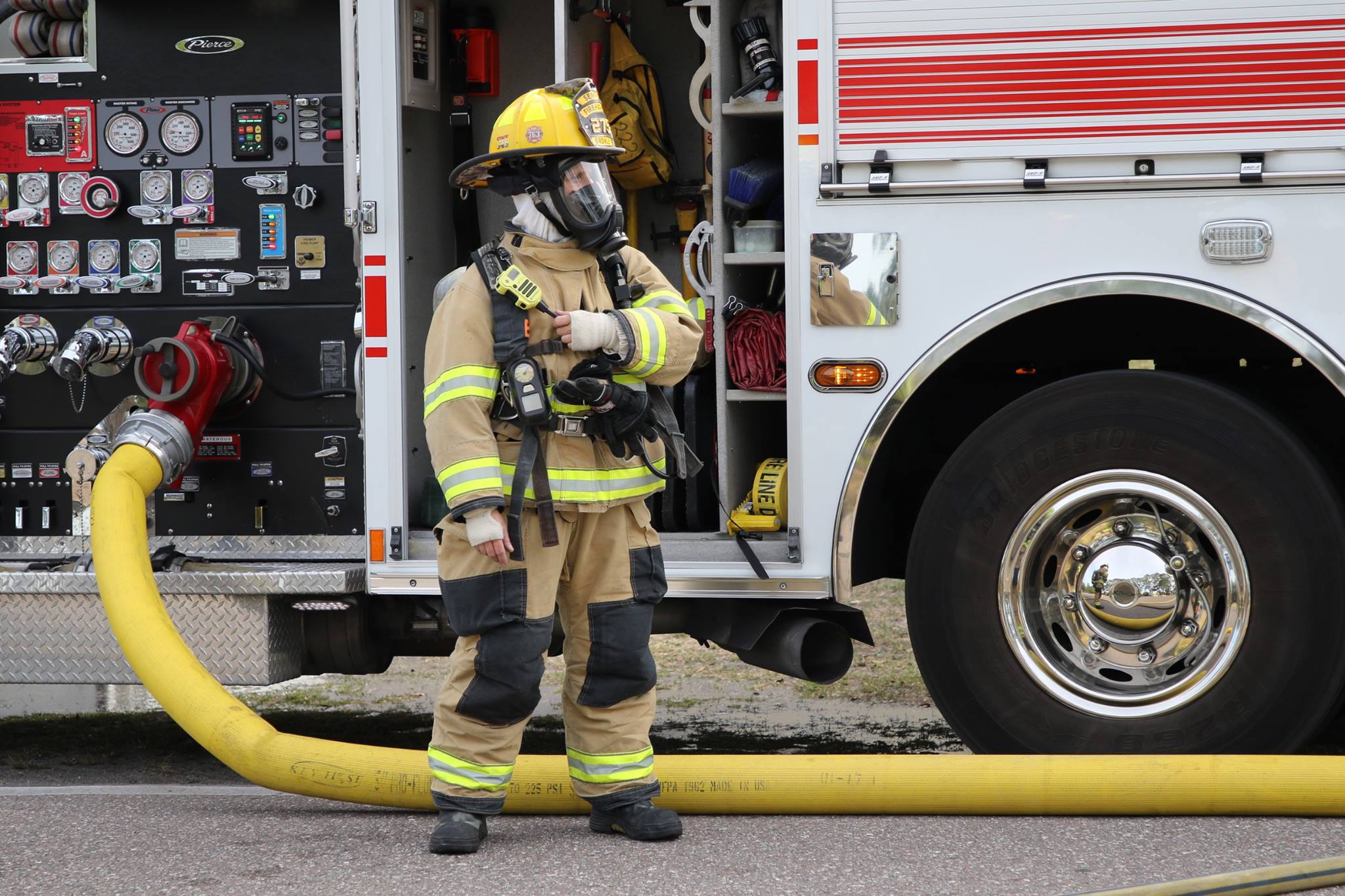 Firefighter in front of fire truck